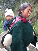 Women carry children in scarf on the back